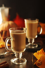 Glasses with warm pumpkin latte