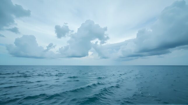 Serene Seascape with Rolling Ocean Waves and Cloudy Horizon