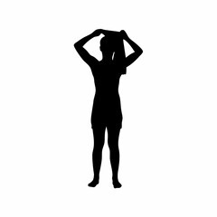 Silhouette of a person drying their hair with a towel