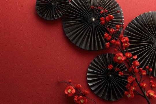Red background with black fans and blossoms