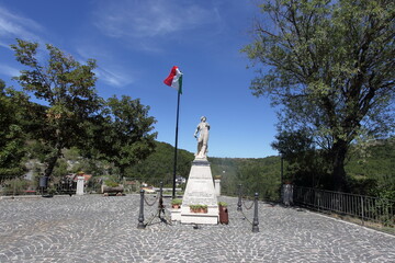 War memorial with Italian flag in Sant’Angelo in Grotte, Molise, Italy