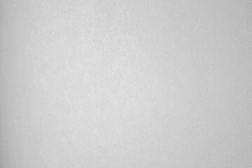 It is a close-up of white wallpaper.