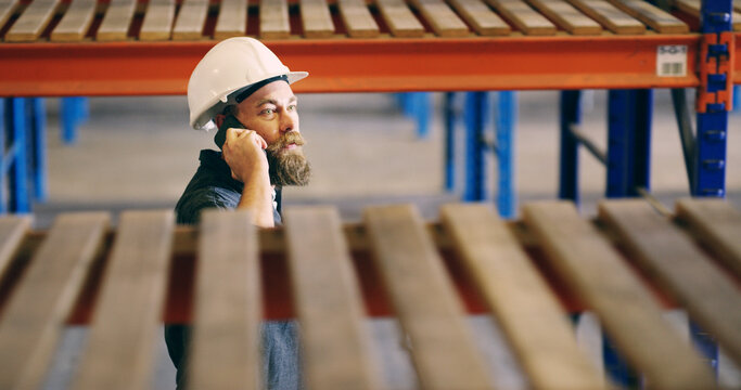 Man, logistics and worker with phone call in warehouse for inventory shortage, supply chain or inquiry. Above, inspector and speaking to supplier for delivery schedule, shipping delay and inspection