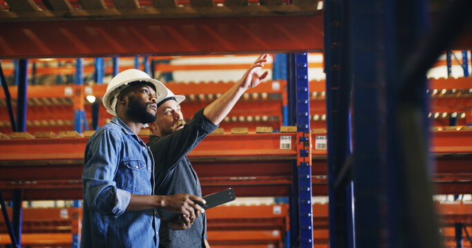 Collaboration, pointing and tablet with construction worker men in warehouse for inspection. App, engineering and security with developer team in depot for maintenance, planning or project management