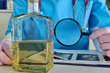 Medical professional analyzes a liquid sample with a magnifying glass