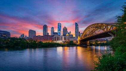 Naklejka premium Vibrant City Skyline Against a Beautiful Sunset Sky
