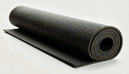 Rolled up black yoga mat, ready for use, resting on a plain surface.