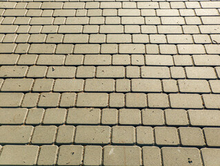 A close up of a brick sidewalk with a lot of small squares