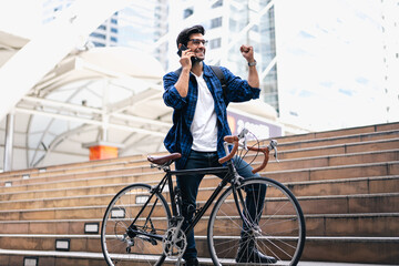 Smart businessman ride bicycle in downtown. Environmentalist commuting by cycling reduce carbon footprint global warming. Bike to work eco friendly alternative transportation green energy vehicle