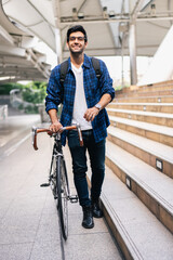 Smart businessman ride bicycle in downtown. Environmentalist commuting by cycling reduce carbon...