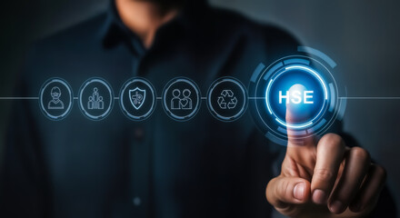 Businessman touching a digital interface with hse icon and related safety and security symbols, representing health, safety, and environment management