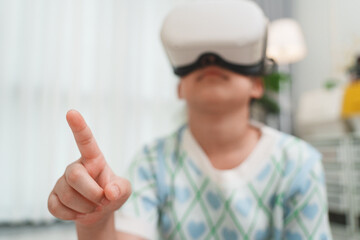 Child wearing VR headset gesturing in virtual world.