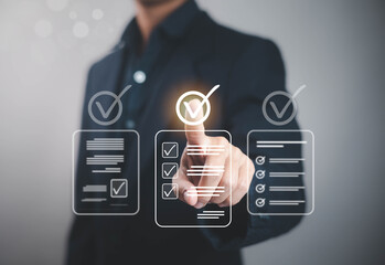 Businessman selecting digital checklist with check mark icons on virtual screen, concept of task...