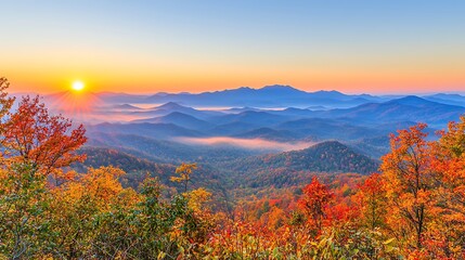 Golden sunrise over foggy mountain valley taken with a mirrorless camera using 24-70mm f2.8 lens, focus on mist rolling through valleys, warm natural light illuminating ridge lines