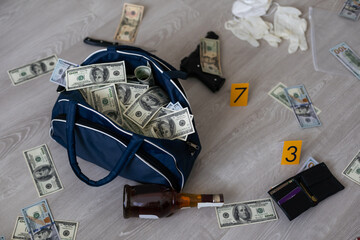 Black duffel bag full of dollar notes in criminal investigation unit, conceptual image