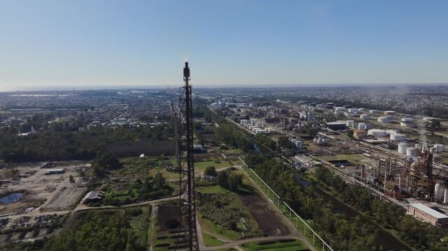 Oil refinery and gas plant in Argentina with flare stack flame visible
