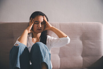 Despair sorrow person in empty dark room, Depressed young woman covering face with hands. Young woman coping with distress covering face. mental health concept. Boring sad upset frustrated stressed.