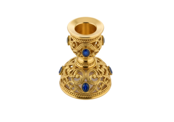 Ornate gold candleholder with intricate filigree design and blue gemstones displays elegant craftsmanship.