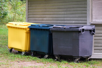 Three trash containers