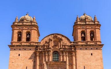 Historic stone cathedral with twin bell towers in Cusco.