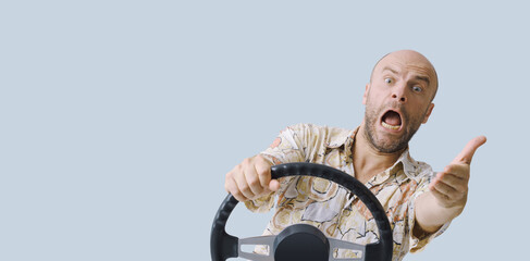 Aggressive driver gesturing and holding the steering wheel
