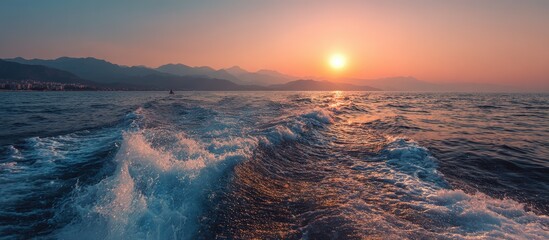 Sunrise over the ocean, waves crashing