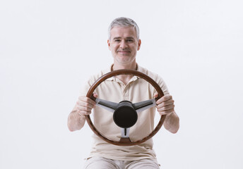 Man holding a steering wheel and driving an invisible car