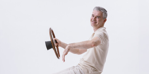 Man holding a steering wheel and driving an invisible car