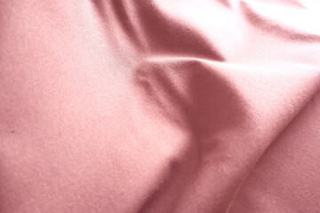 Fototapeta premium Red silk fabric drapes, studio shot, elegant waves, background blur, textile design