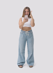 Cheerful woman receiving a surprise on her smartphone