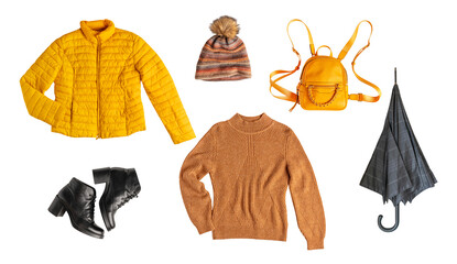 Set or collection of autumn wardrobe essentials clothes of warm yellow colour of knitted sweater, casual jacket, hat, bright backpack, black umbrella and leather shoes isolated on white background
