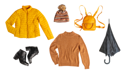 Set or collection of autumn wardrobe essentials clothes of warm yellow colour of knitted sweater, casual jacket, hat, bright backpack, black umbrella and leather shoes isolated on white background