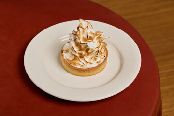 Indulge in a Delicious Meringue Tart elegantly presented on a Beautiful Plate for Dessert