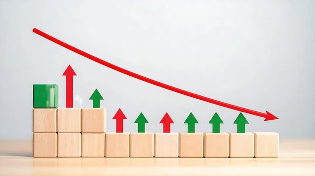 Wooden block chart with red and green arrows showing growth and decline trends in business performance and market progress on light background