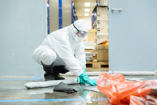 people cleaning chemical leak absorbent