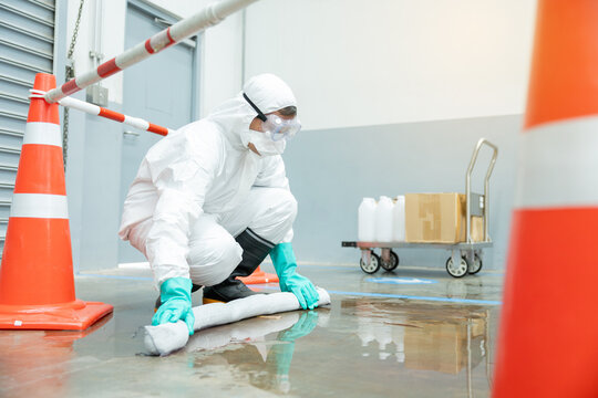 people cleaning chemical leak absorbent