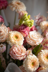 Close-up of delicate pink and white flowers with lush green foliage