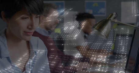 Typing Chinese woman and colleagues coding on keyboards at open office, digital overlay, copy space