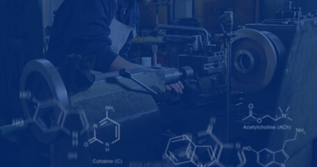Operating machinist adjusting lathe chuck at machine shop, with formula overlays, copy space