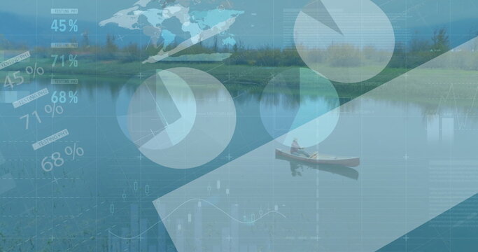 Canoeing man wearing red jacket and cap paddling on lake, with digital data overlays - Powered by Adobe