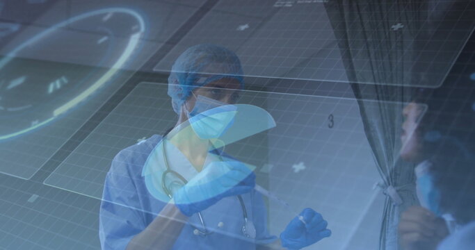 Preparing syringe by clinician in scrubs, gloves, mask and stethoscope in cubicle with curtain - Powered by Adobe