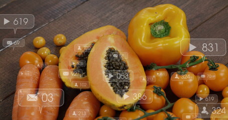 Displaying papaya halves exposing seeds on wooden table with produce and translucent overlay icons
