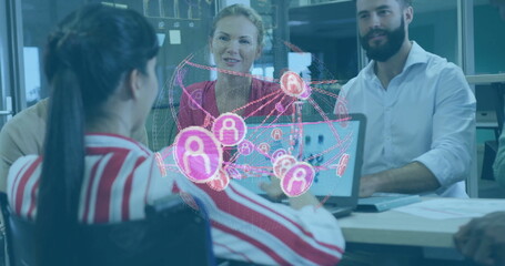 Leading woman in wheelchair steering meeting at glass table with laptop and holographic overlay