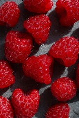Top view of Fresh Sweet Raspberries, close up. Vibrant Red Color and Juicy Texture for healthy food.