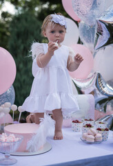 Little girl celebrating her birthday,Adorable toddler girl celebrating her birthday