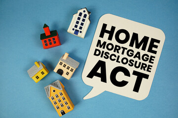 HMDA Home Mortgage Disclosure Act text with house models on blue background