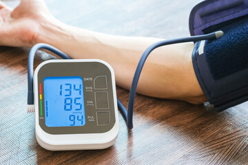 Man check blood pressure monitor and heart rate monitor with digital pressure gauge. Health care...