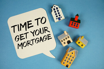 Time To Get Your Mortgage text with house models on blue background