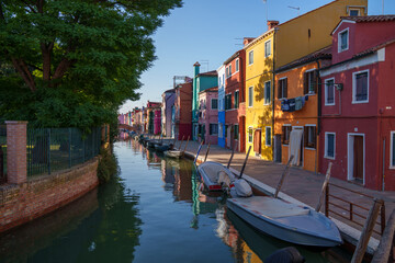 Colorful Buildings Along Canal in Bright Sunlight