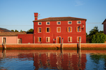 Red Building by Canal at Sunrise